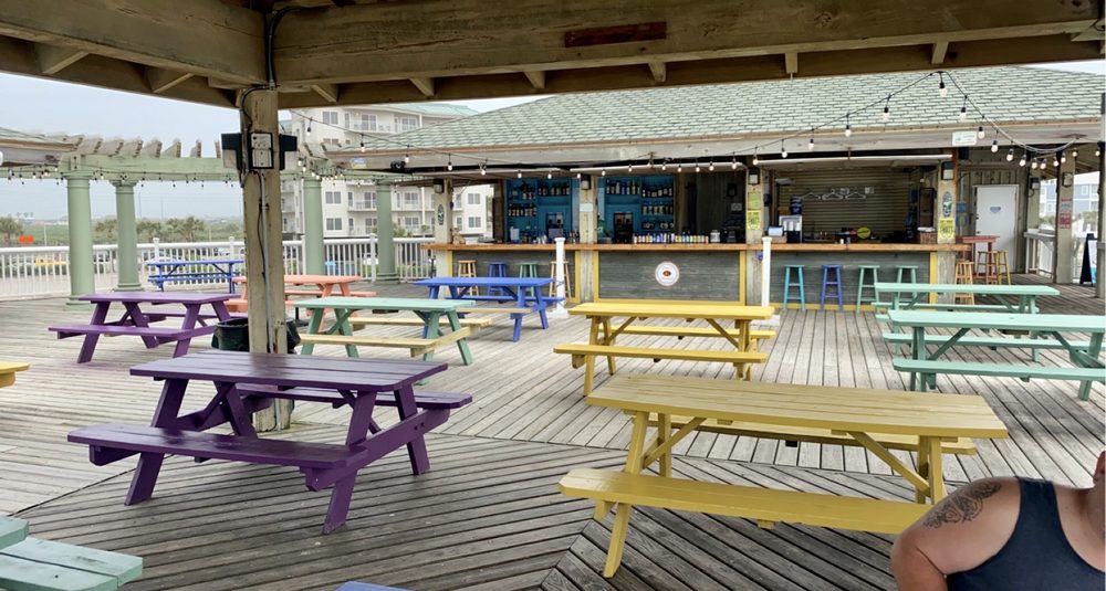 🐢 Tipsy Turtle Seaside Bar & Grill – A breezy beachfront hangout tucked beside Beach Pocket Park #2, this laid-back spot serves up tacos, fry baskets, and tropical cocktails with a splash of seaside charm. With picnic tables on the sand, live music, and panoramic Gulf views, it’s a casual escape for beachgoers looking to sip, snack, and soak up the island vibe.